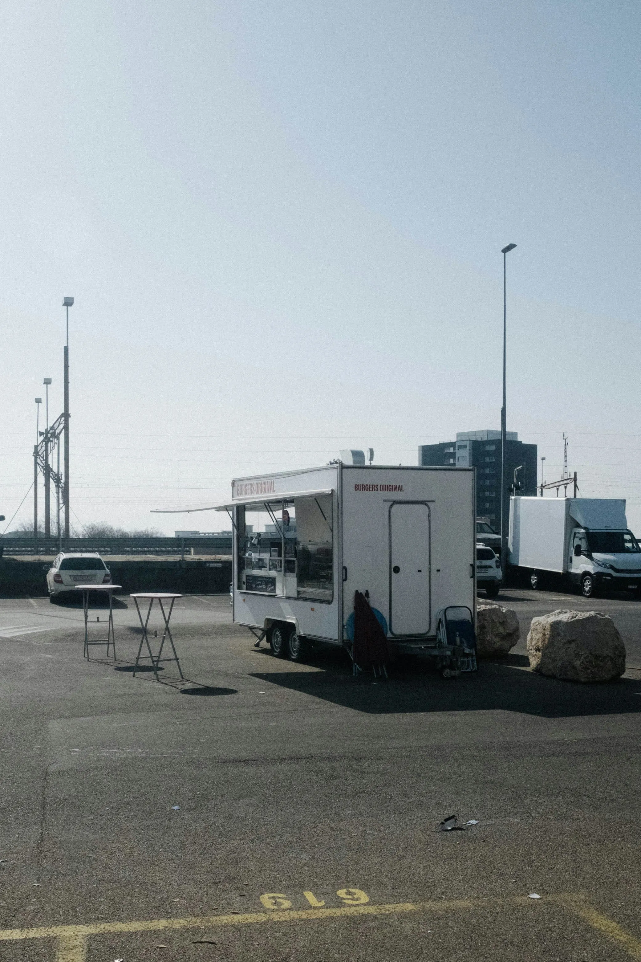 A white food truck parked in a lot — the kind of mobile kitchen Garcia Brothers services with freshwater delivery and gray water removal